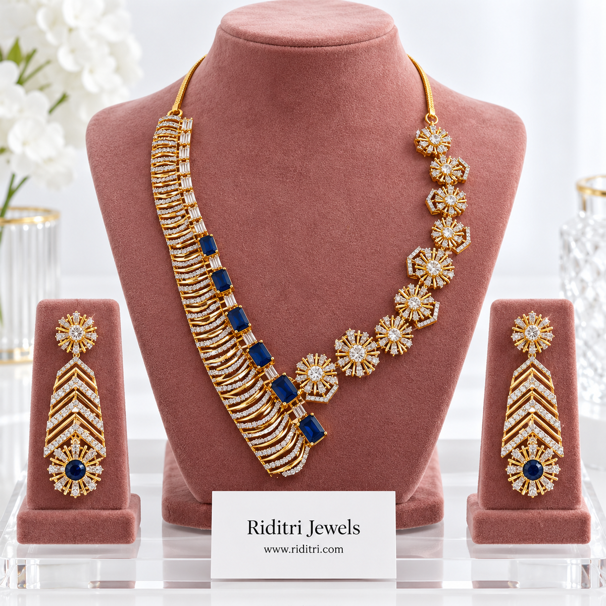 Neelam asymmetric AD necklace set with sapphire blue stones and matching chevron earrings