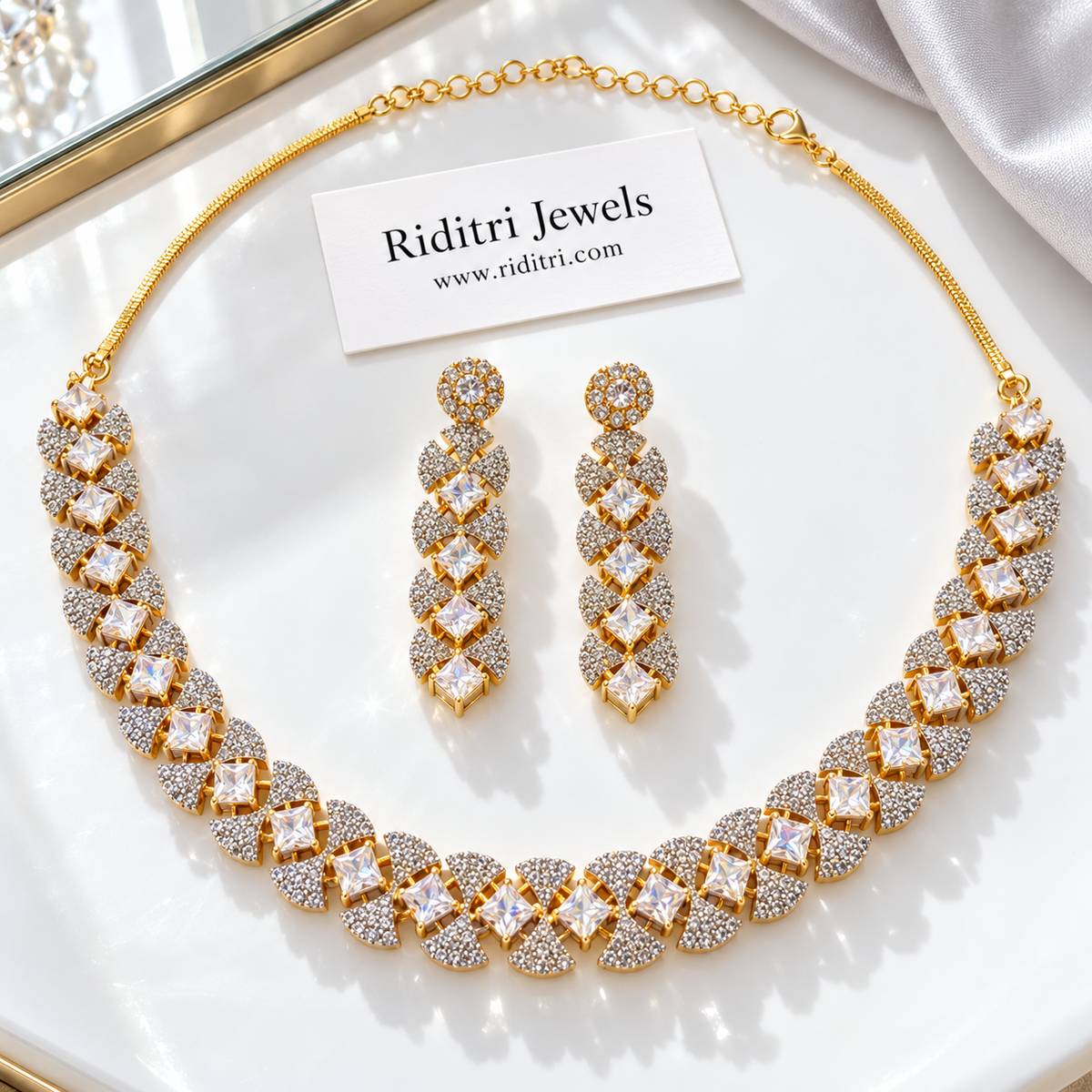 Diamond-look necklace with square princess-cut stones and pave fan motifs