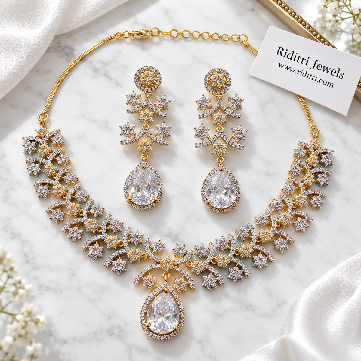 White teardrop AD earrings with halo stud and floral arc tiers for parties