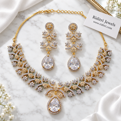 White teardrop AD earrings with halo stud and floral arc tiers for parties