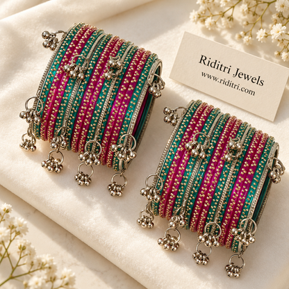Close view of rani and radium glass bangles with dangling Kashmiri ghungroo bells