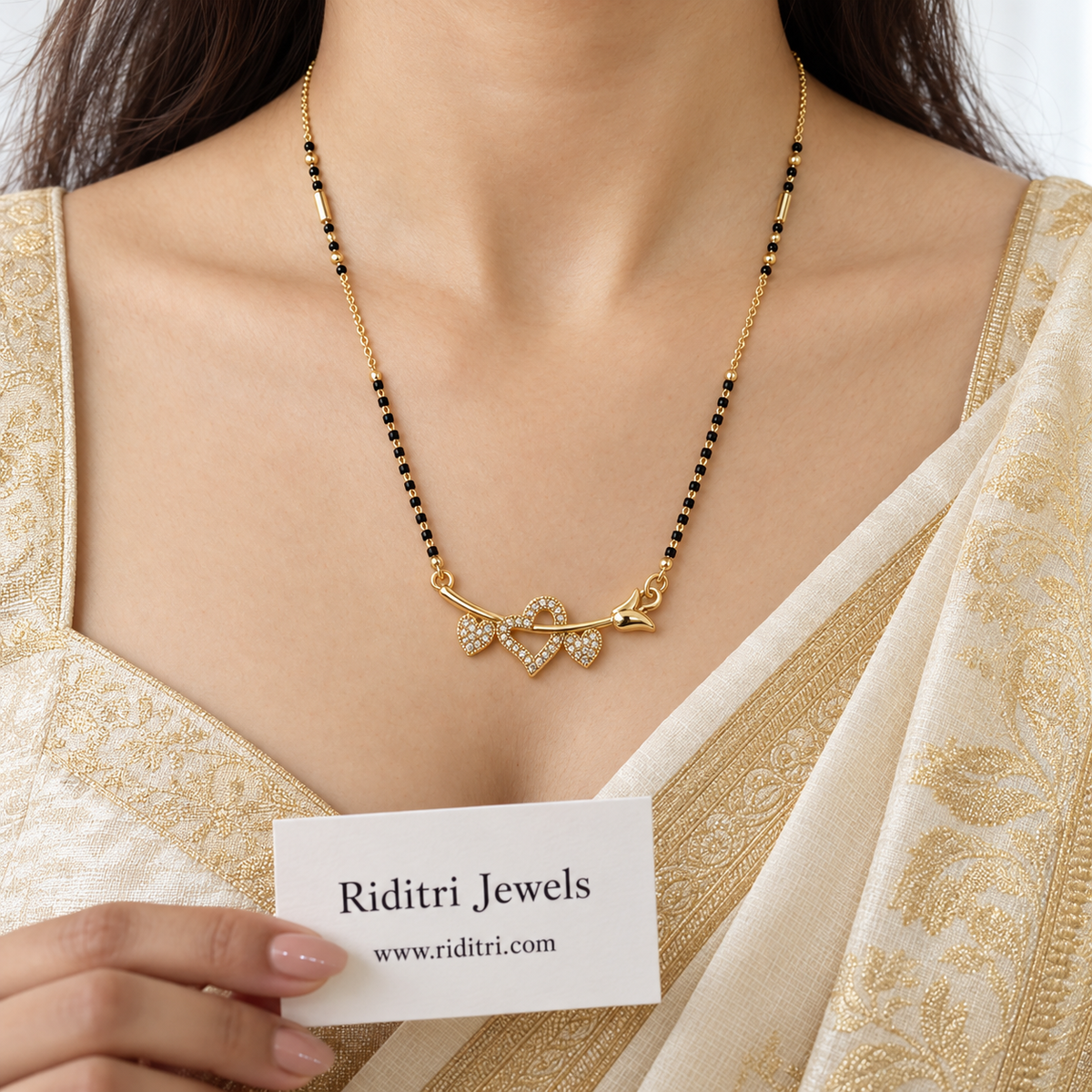 Daily wear black bead mangalsutra chain with gold beads and heart pendant