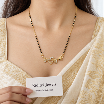 Daily wear black bead mangalsutra chain with gold beads and heart pendant