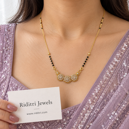 Daily wear black bead mangalsutra chain with gold beads and diamond-look cluster pendant