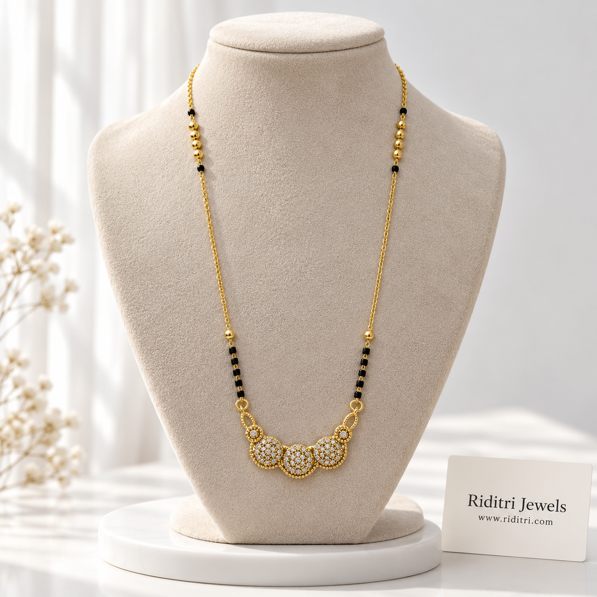 Gauri anti-tarnish mangalsutra with three round AD stone clusters and black beads
