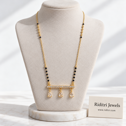 Minimal gold-toned mangalsutra pendant with AD stone bar and swinging teardrops