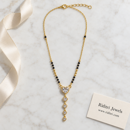 Gold-toned mangalsutra pendant with big heart stone and four falling heart drops