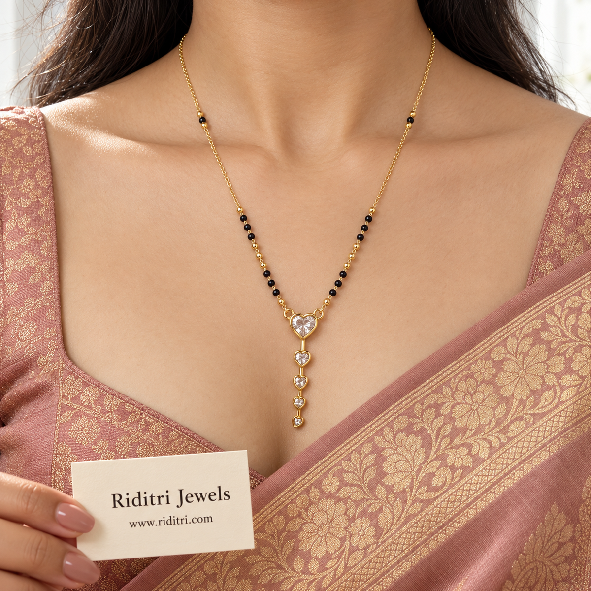 Daily wear round black bead mangalsutra chain with gold beads and heart drop pendant