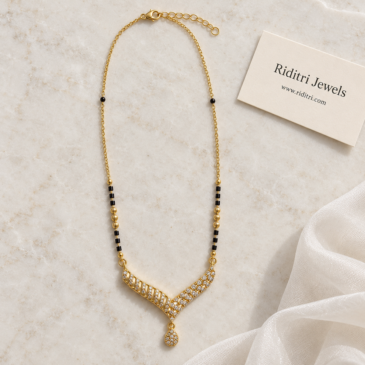 Daily wear black bead mangalsutra chain with textured gold beads and V pendant