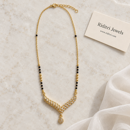 Daily wear black bead mangalsutra chain with textured gold beads and V pendant