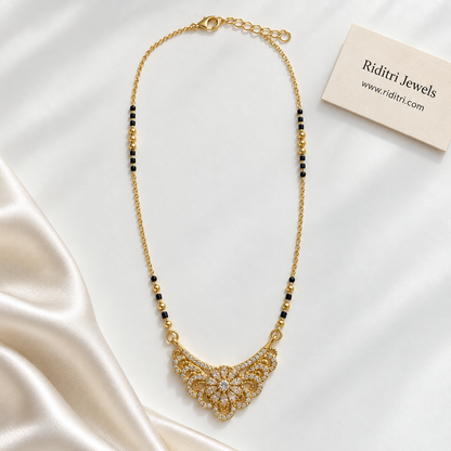 Black bead mangalsutra chain with gold beads and diamond-look floral pendant