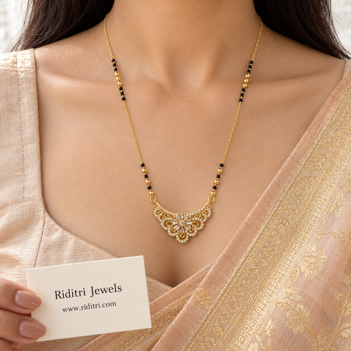 Gold-toned lace-style floral mangalsutra pendant with pear-cut stone flower