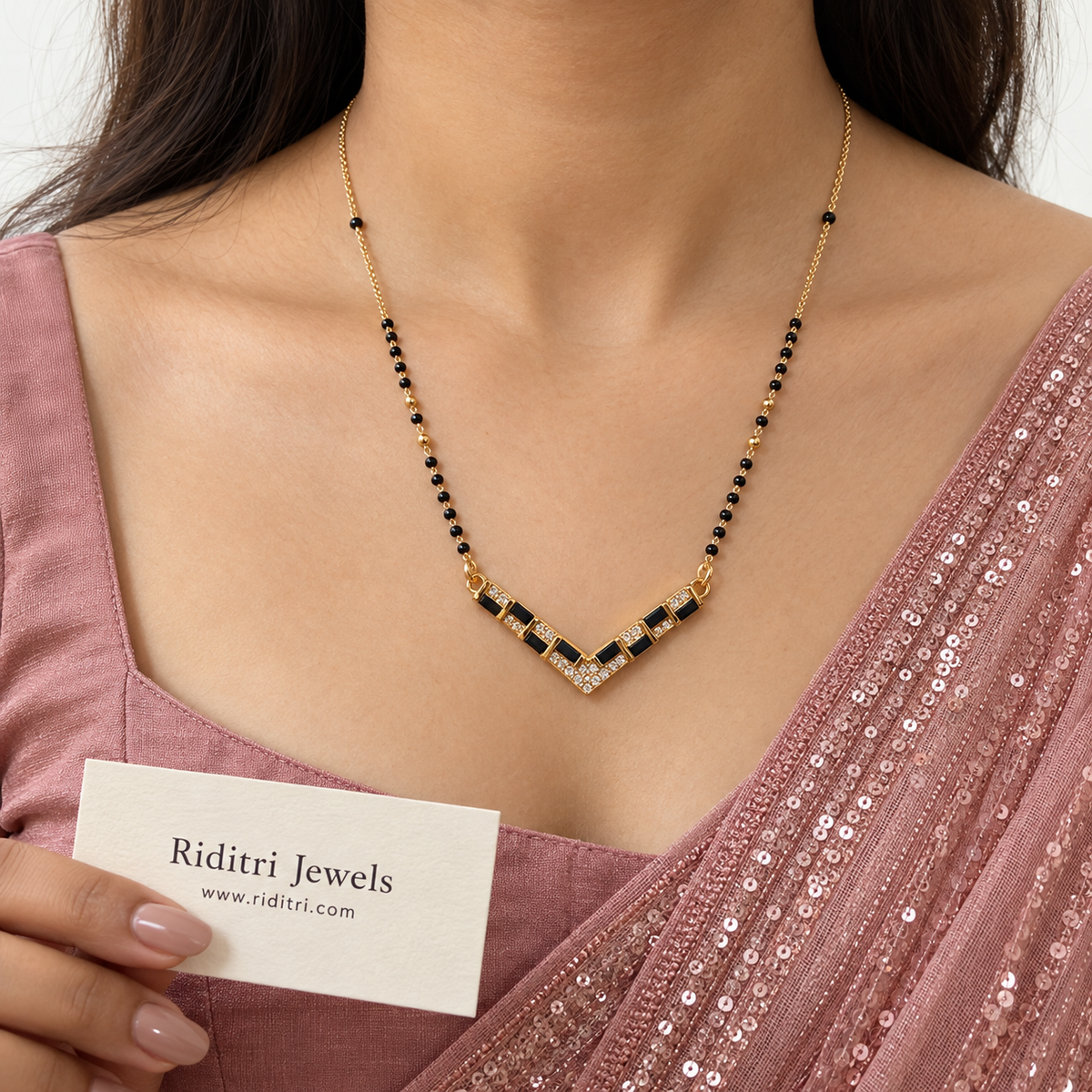 Gold-toned V-shape chevron mangalsutra pendant with black and white stones