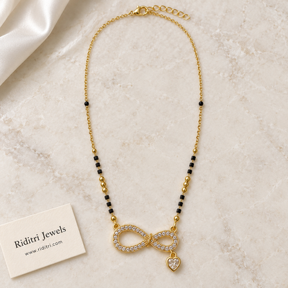 Daily wear black bead mangalsutra chain with gold beads and infinity heart pendant