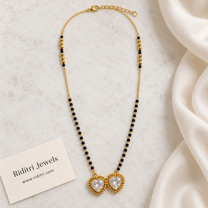 Gold-toned mangalsutra pendant with two big heart stones in beaded gold frames