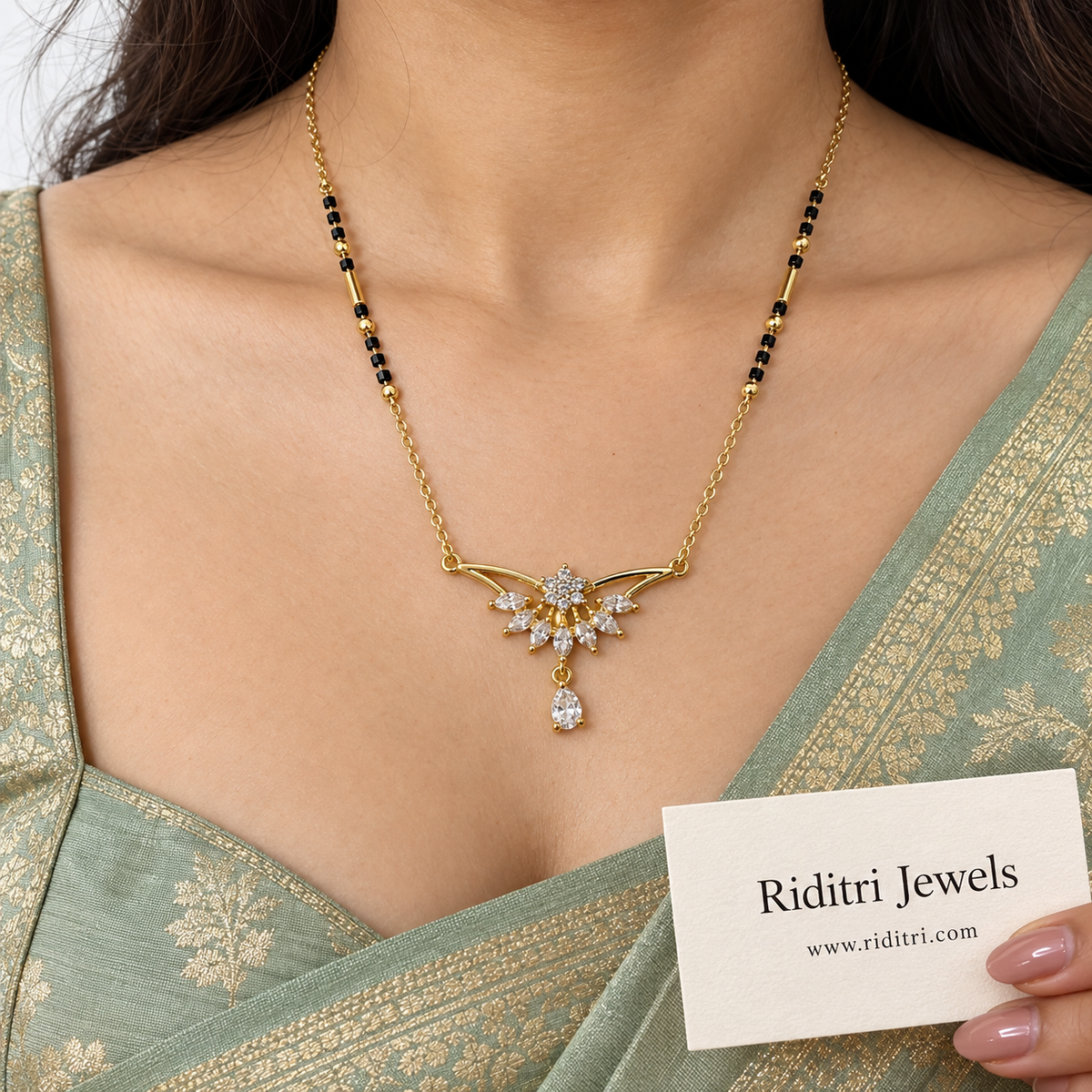 Gold-toned winged mangalsutra pendant with fan of marquise AD stones