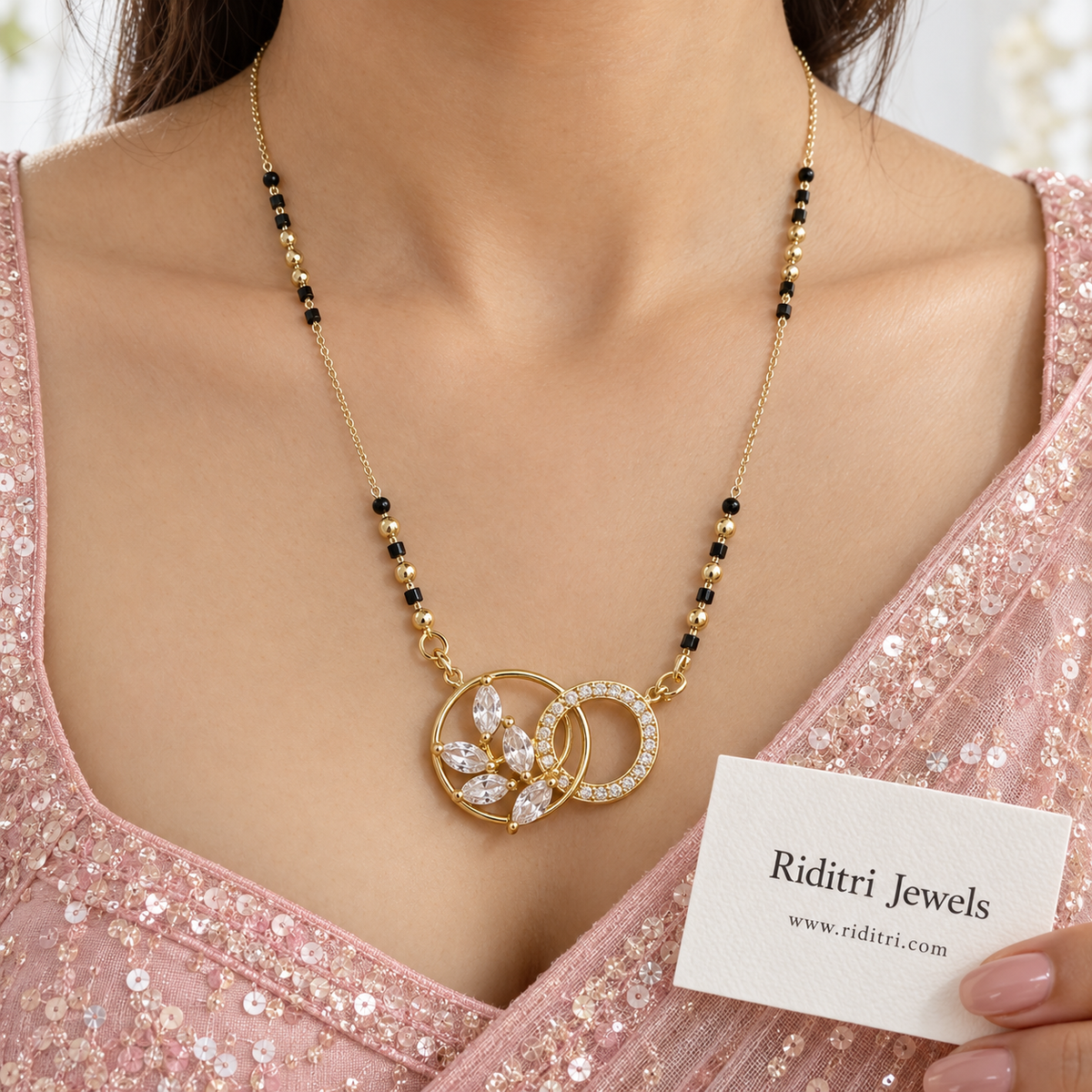 Gold-toned interlocked circles mangalsutra pendant with stone-lined ring