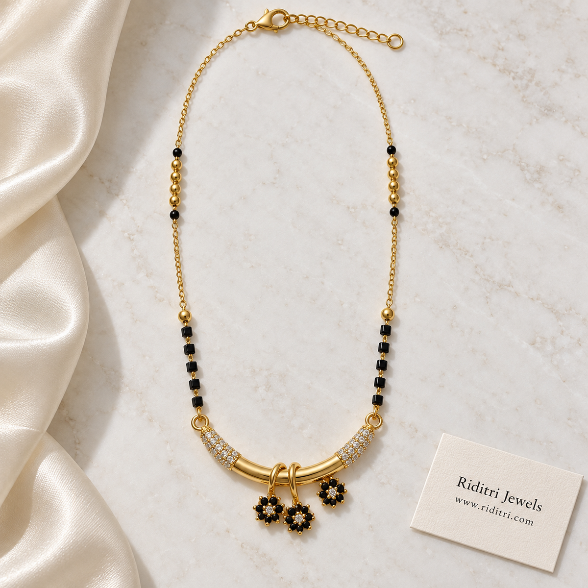 Daily wear black bead mangalsutra chain with gold beads and flower charm pendant