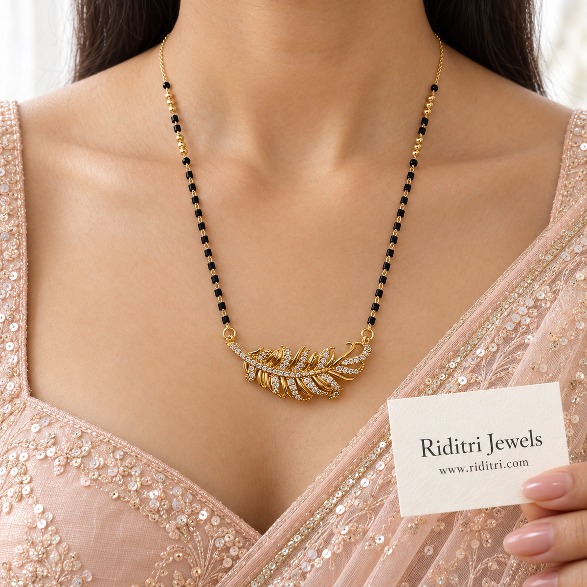 Mor Pankh anti-tarnish feather mangalsutra with AD stone gold feather and black beads