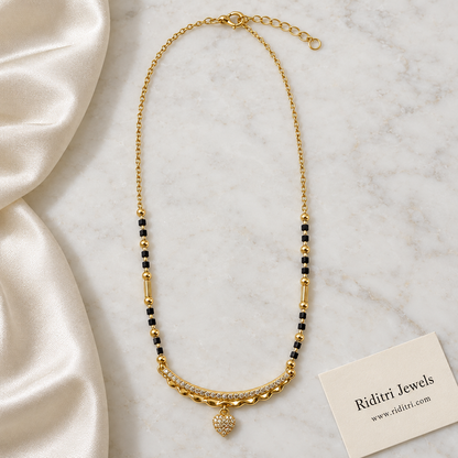 Gold-toned curved bar mangalsutra pendant with wavy edge and small heart drop
