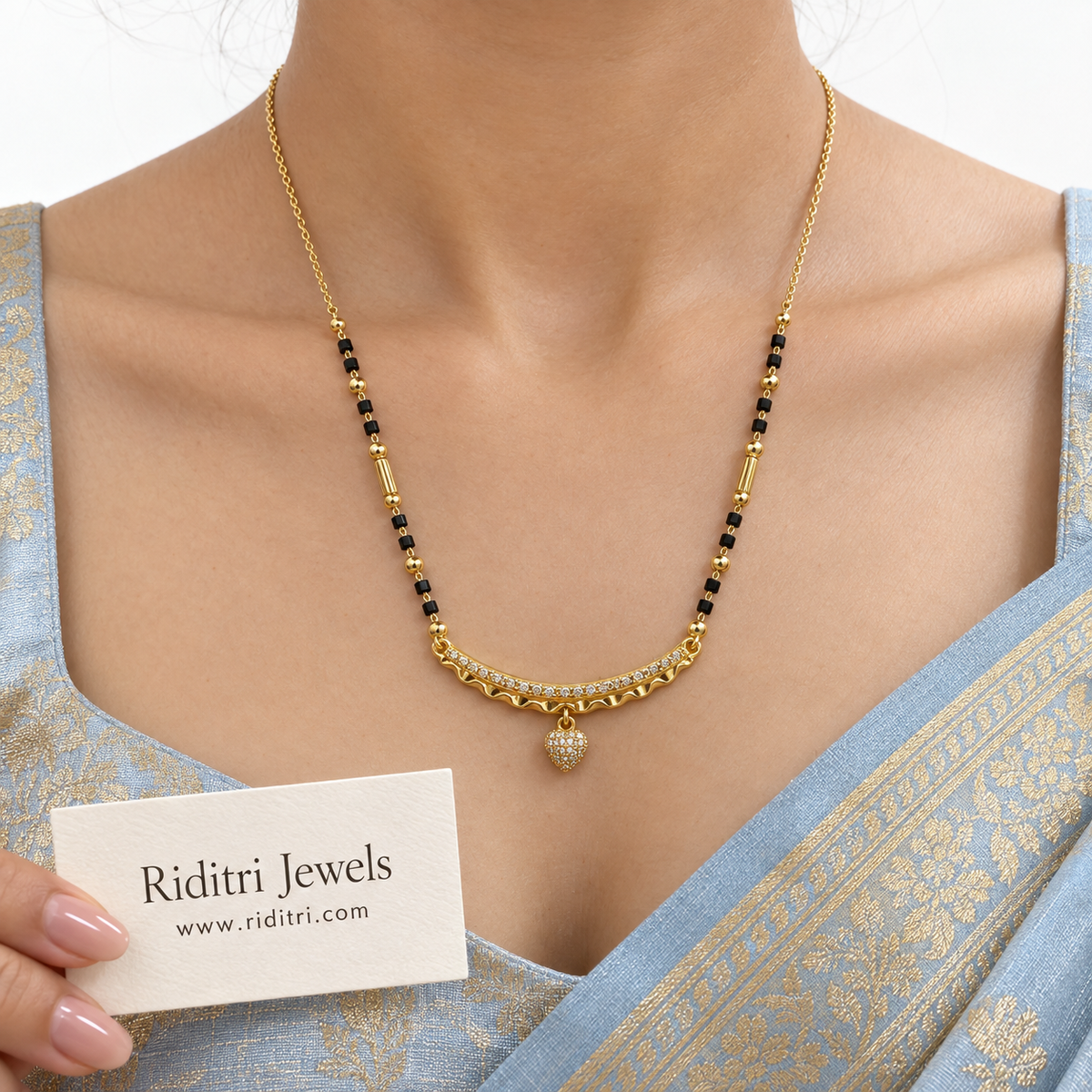 Black bead mangalsutra chain with engraved gold beads and heart charm bar pendant