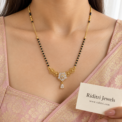 Gold-toned openwork flower mangalsutra pendant with pear and baguette stone bloom