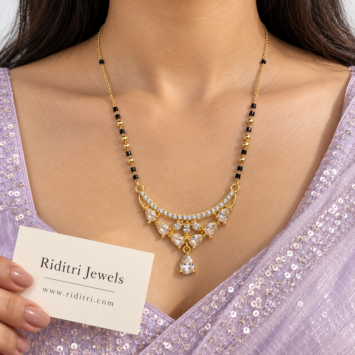 Black bead mangalsutra chain with polished gold beads and crescent teardrop pendant