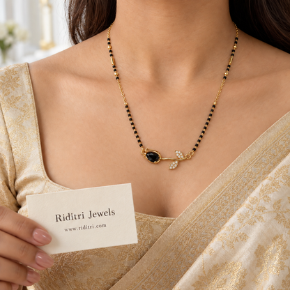 Gold-toned rose mangalsutra pendant with black stone and AD stone leaves