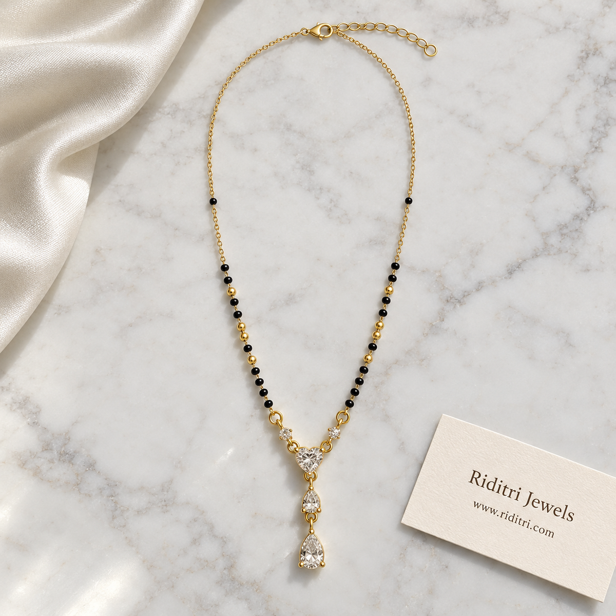 Round black bead mangalsutra chain with gold beads and heart solitaire drop