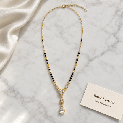 Round black bead mangalsutra chain with gold beads and heart solitaire drop