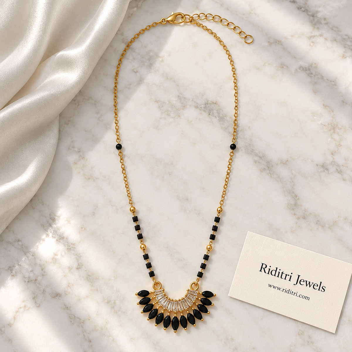 Black bead mangalsutra chain with gold beads and black stone fan pendant