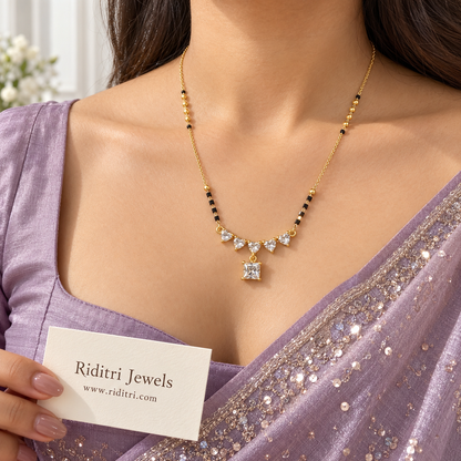 Gold-toned heart row mangalsutra pendant with diamond-look princess-cut drop