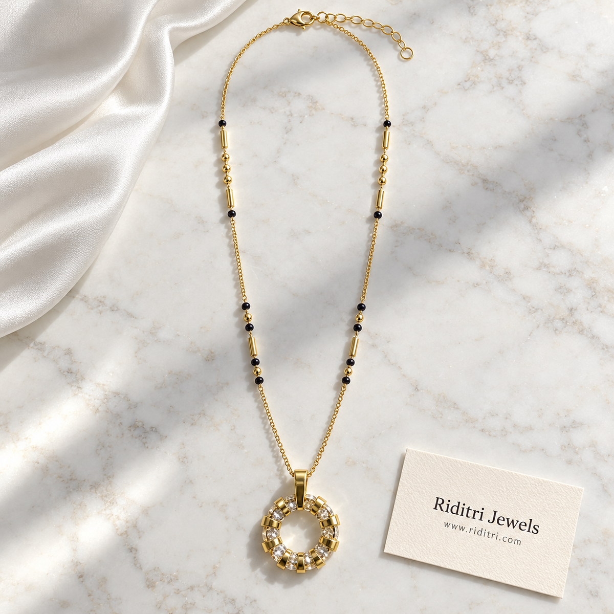 Fine gold chain mangalsutra with black beads, gold tube beads and round sun pendant
