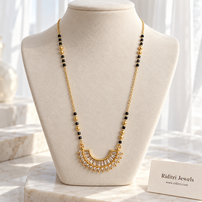 Gold-toned crescent mangalsutra pendant with fanned baguette stones and stone border