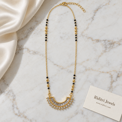 Fine gold chain mangalsutra with black and gold beads and half moon pendant