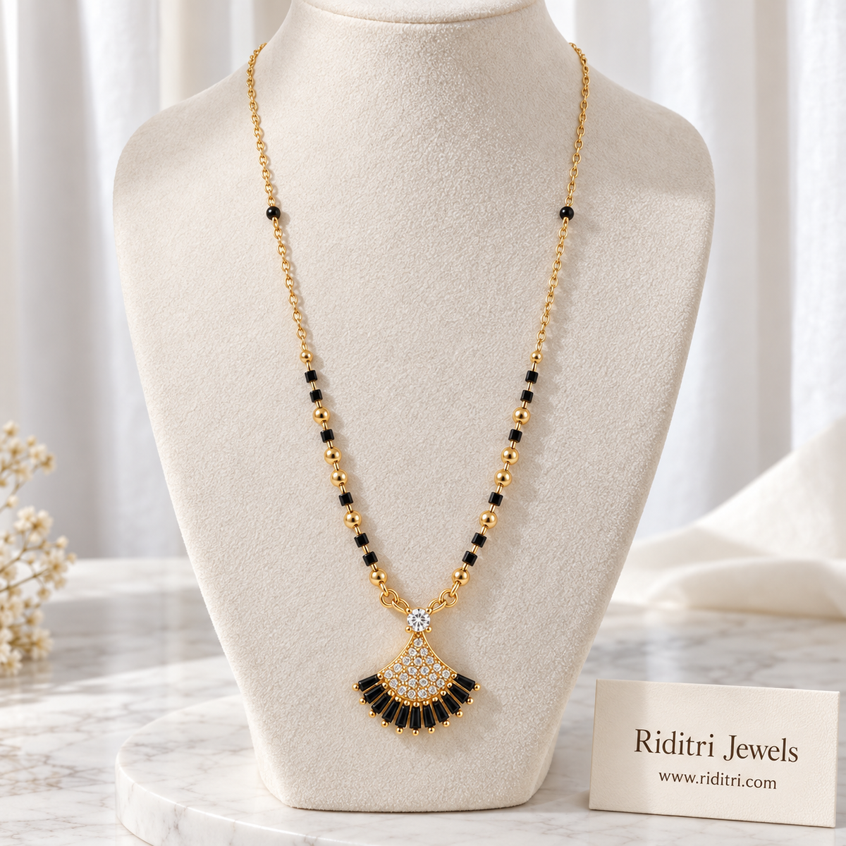 Gold-toned black and white shell fan mangalsutra pendant with black baguette stones