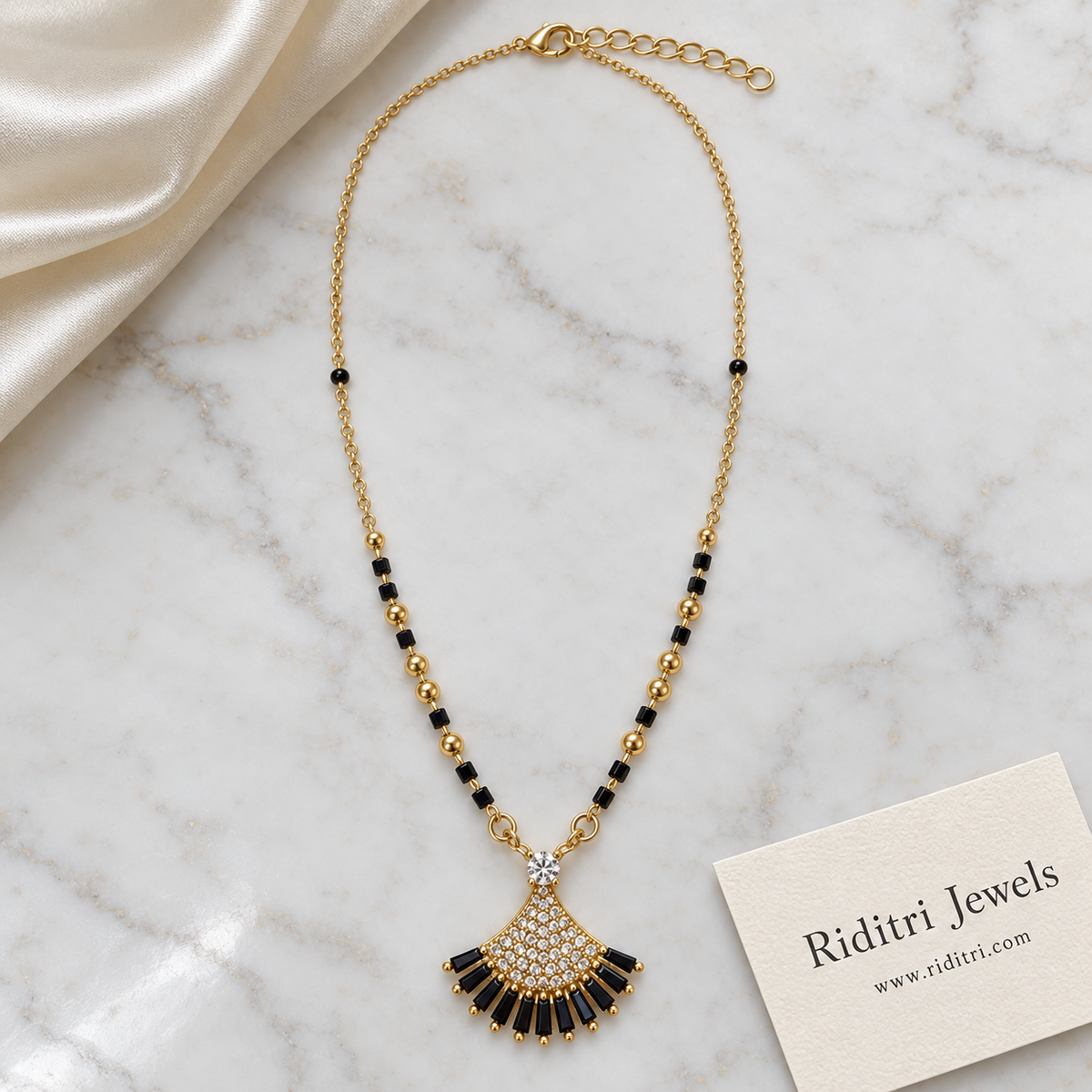 Black bead mangalsutra chain with gold beads and black stone shell pendant