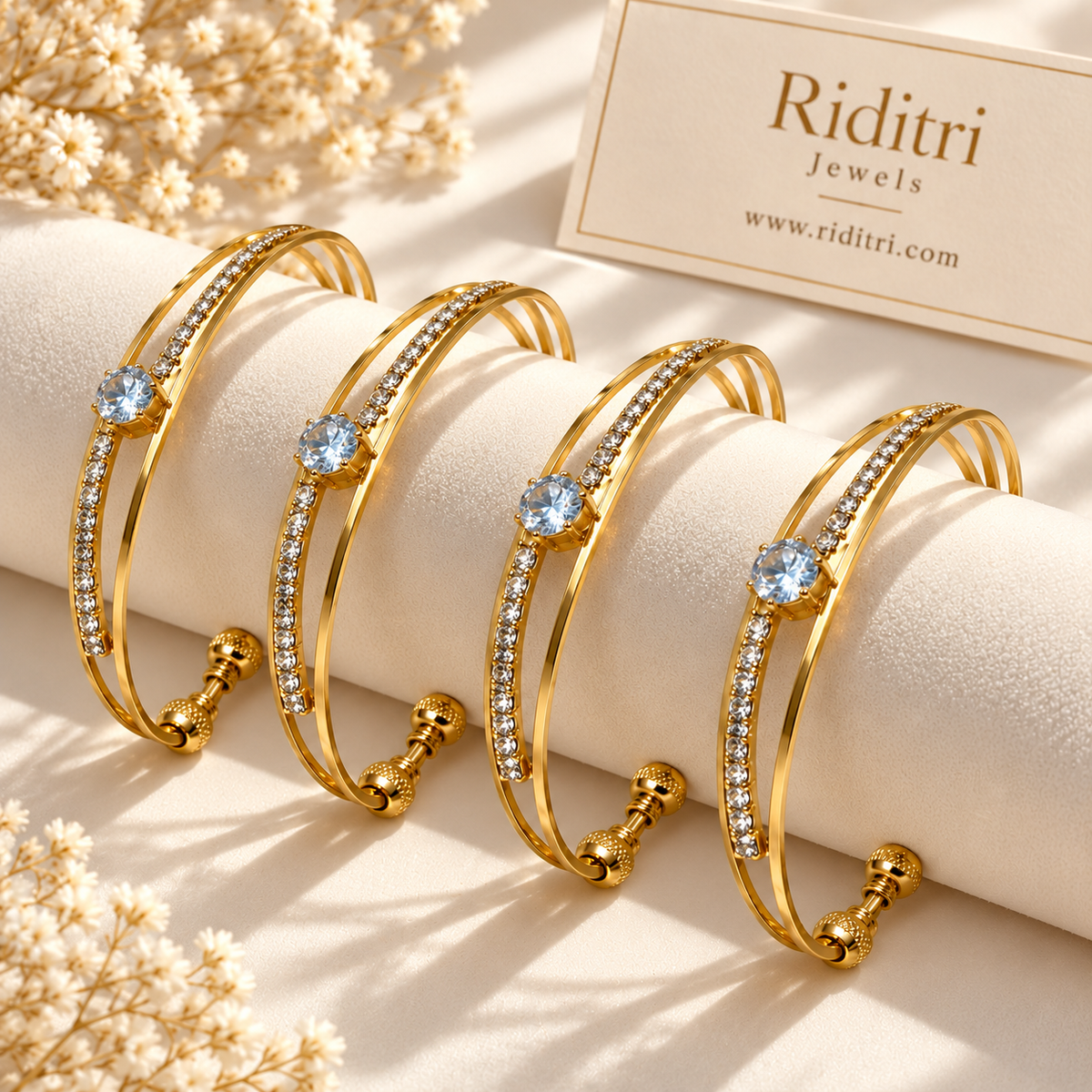 Neelima set of 4 gold-toned adjustable cuff bracelets with light blue solitaire-style stone and AD stones