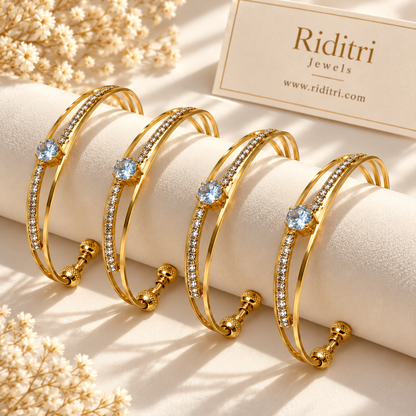 Neelima set of 4 gold-toned adjustable cuff bracelets with light blue solitaire-style stone and AD stones
