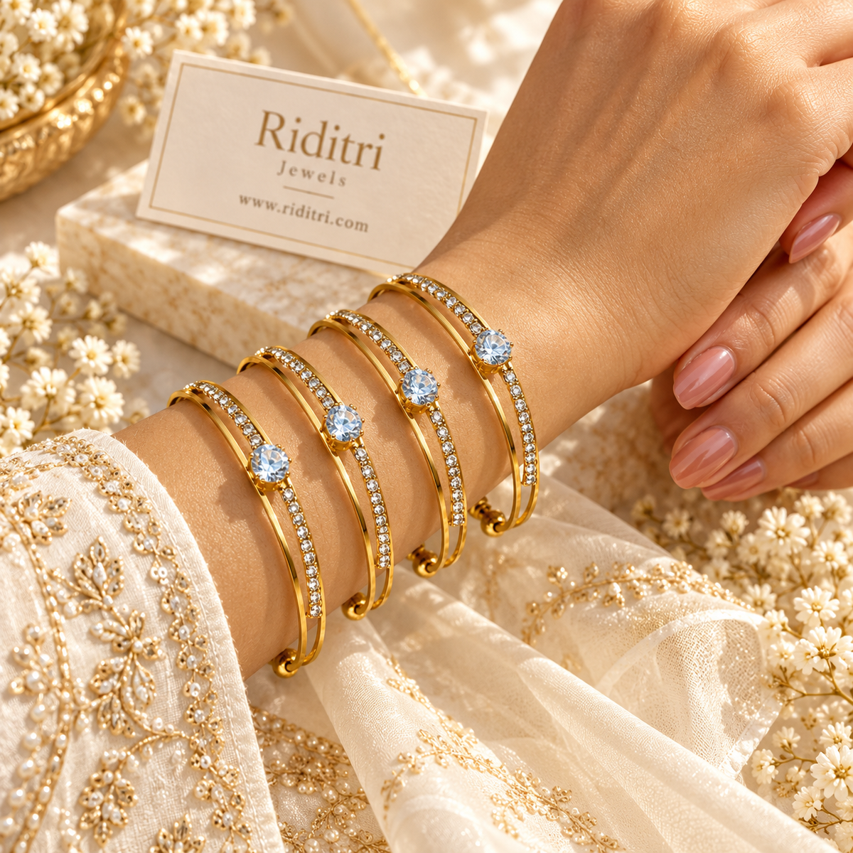 Gold-toned three-band open cuff bracelet with row of white AD stones and textured ball ends