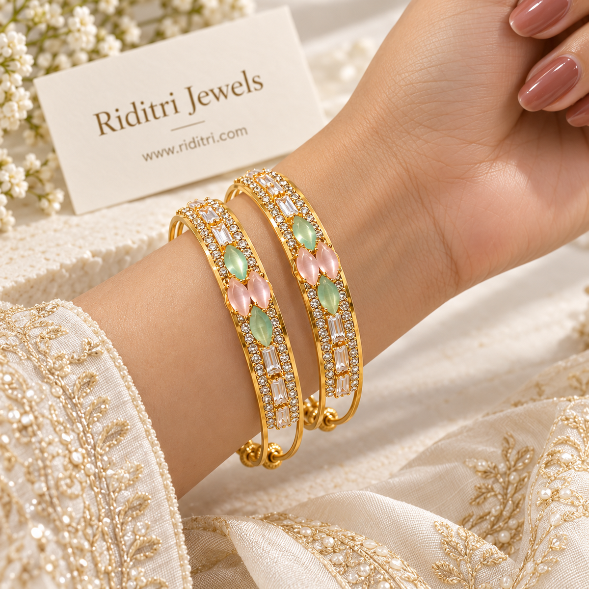 Gold-toned adjustable bangle with pastel stone cluster, baguette stones and slider beads