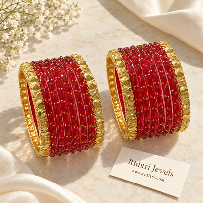 Red faceted glass bangle stack with carved gold side bangles for Karwa Chauth and weddings