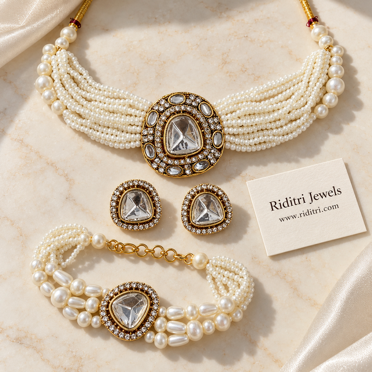 Matching pearl kundan bracelet and big kundan stud earrings with AD stone halo