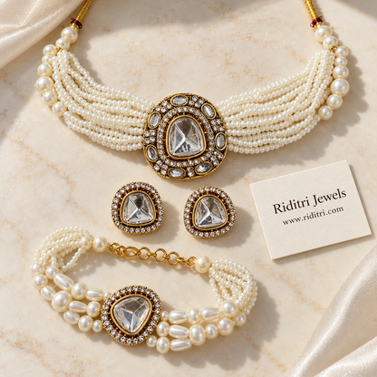 Matching pearl kundan bracelet and big kundan stud earrings with AD stone halo