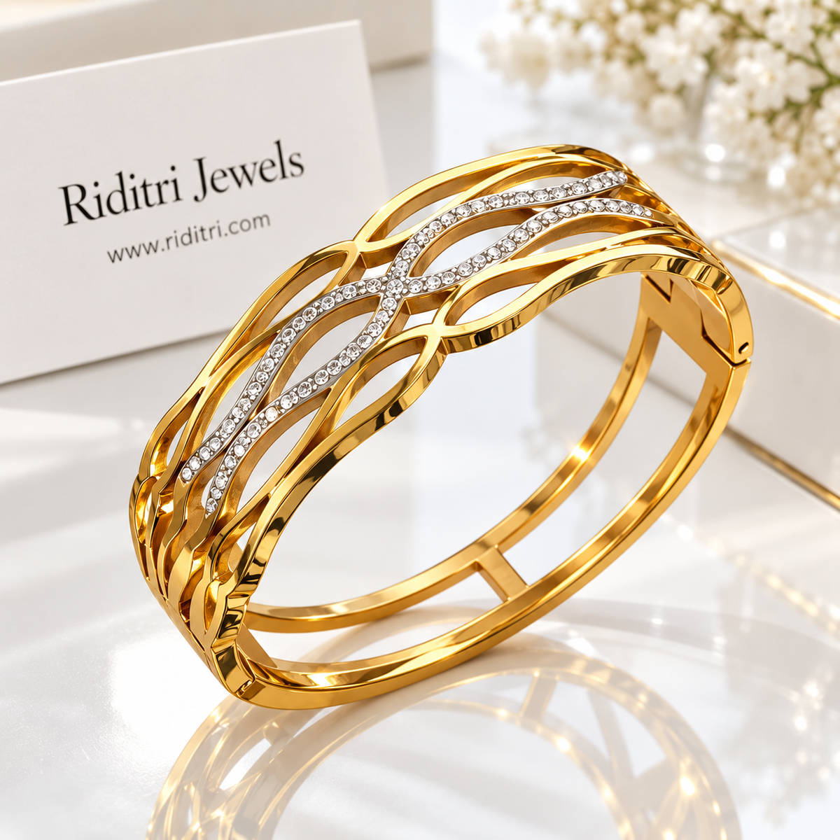 Gold-toned Aura Defined anti-tarnish openable bracelet with wavy openwork and CZ stone lines