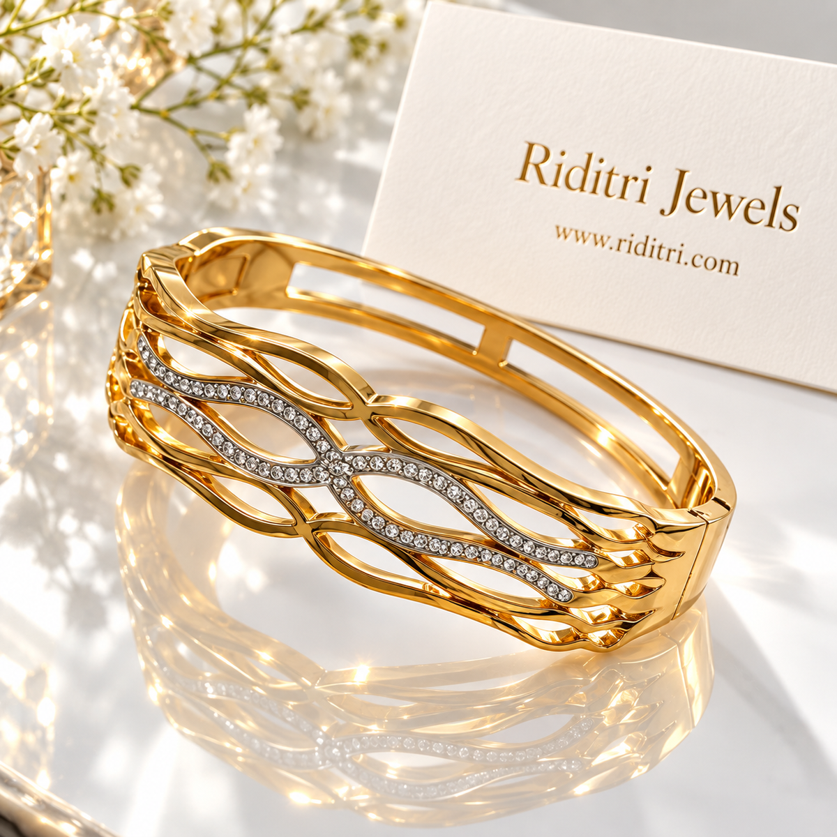 Aura Defined gold-toned cuff-style bracelet with crossing lines of CZ stones