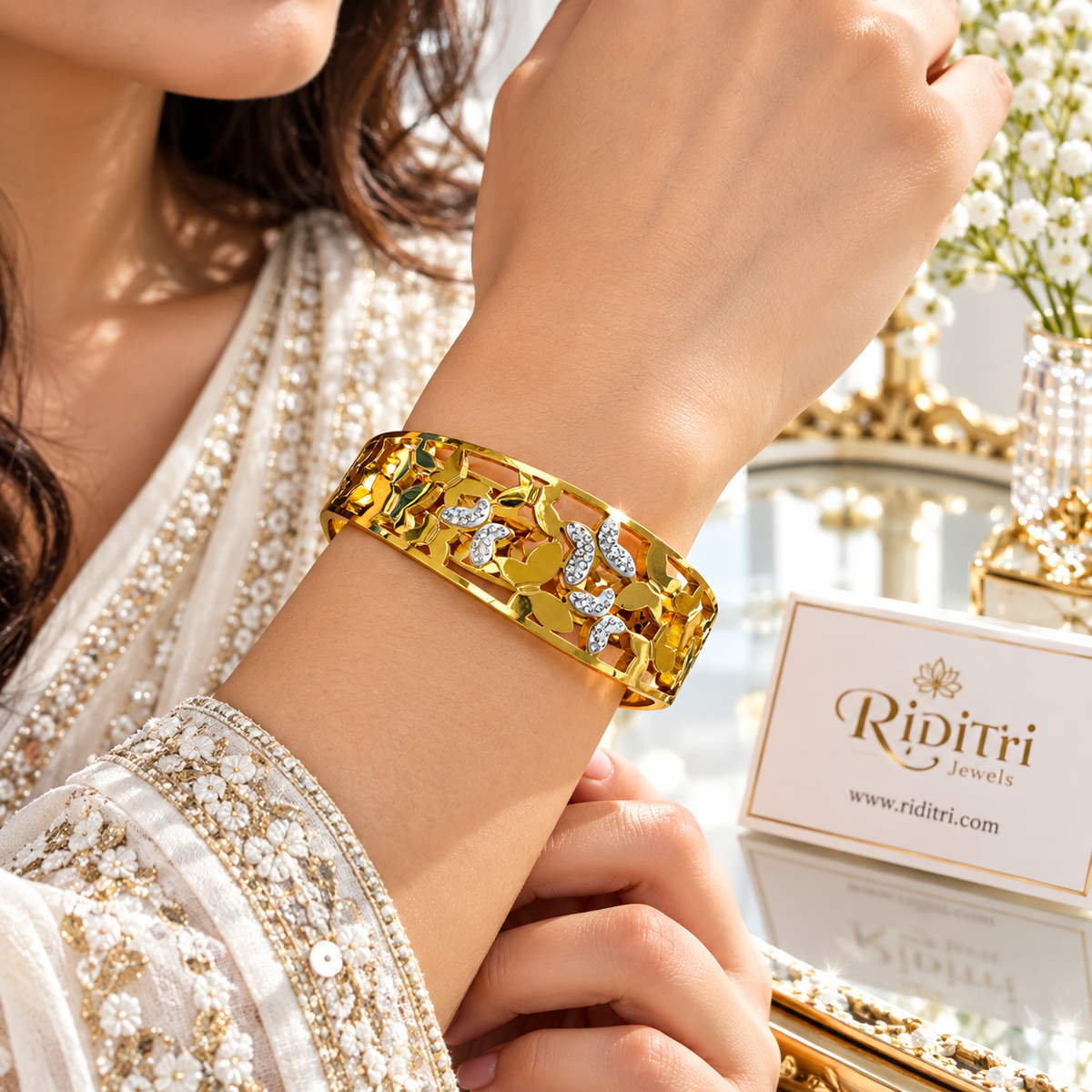Gold-toned Aura Flutter openable bracelet with CZ-studded butterfly design