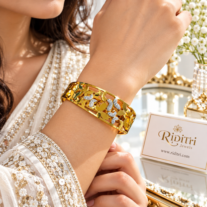 Gold-toned Aura Flutter openable bracelet with CZ-studded butterfly design